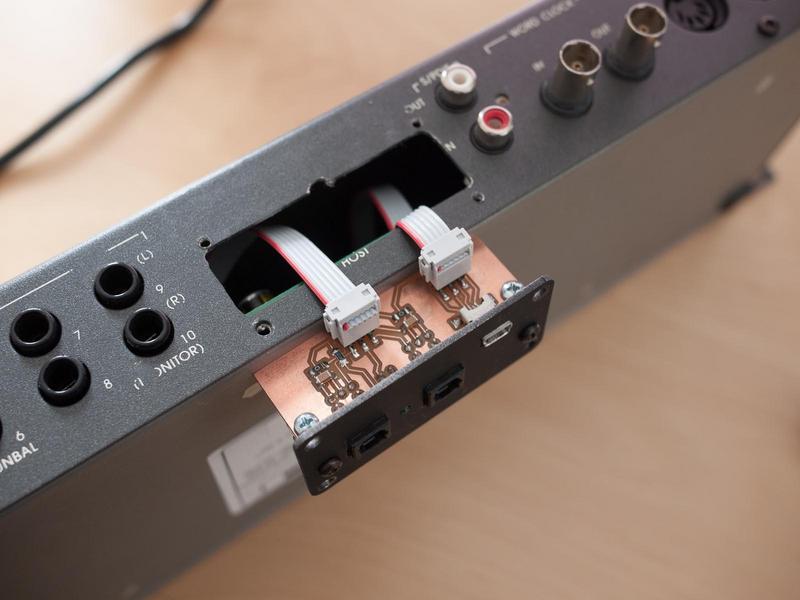 back of the interface box showing where the original DB-25 host
connector has been (somewhat roughly) machined out to provide
clearance for the new I/O board, along with four mounting screw holes