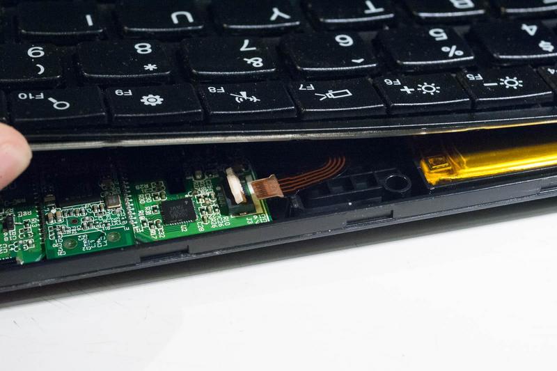 the rear of the case lifted open just enough to reveal the trackpoint
connector