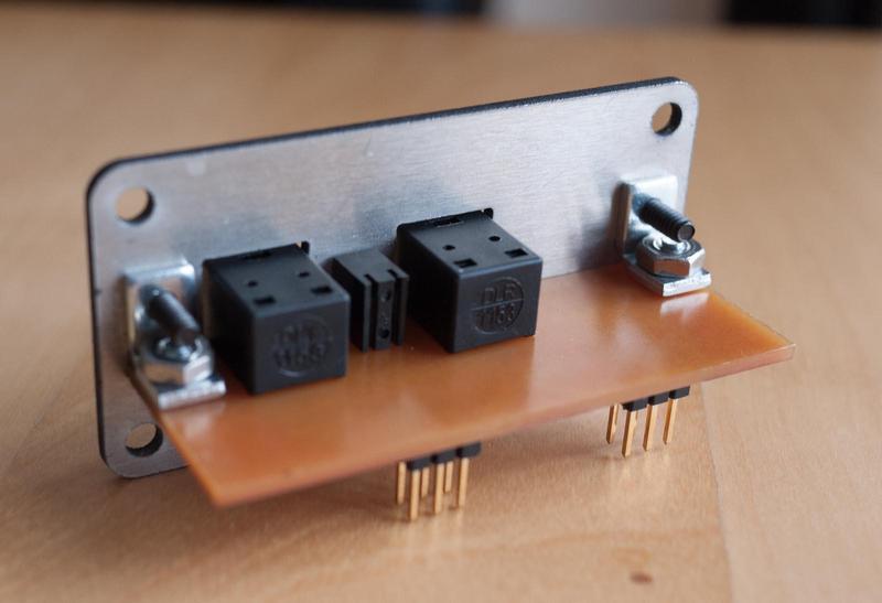 close-up of the component side of the I/O board showing the fiber 
        transmitter and receiver